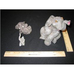 This group of three elephants are very whimsical. The very large elephant is a music box that plays 
