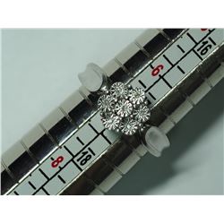 44) STERLING SILVER 7 DIAMOND RING