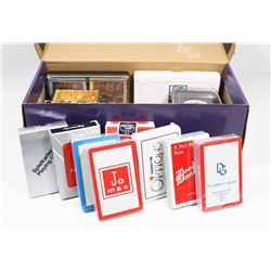 BOX WITH OVER 20 PACKS OF COMPANY PLAYING CARDS.