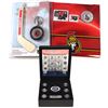 Image 1 : Canada NHL Coin Collection. You will receive the 2009 $1 Calgary Flames Mini-Puck & Mini-Stick Set, 