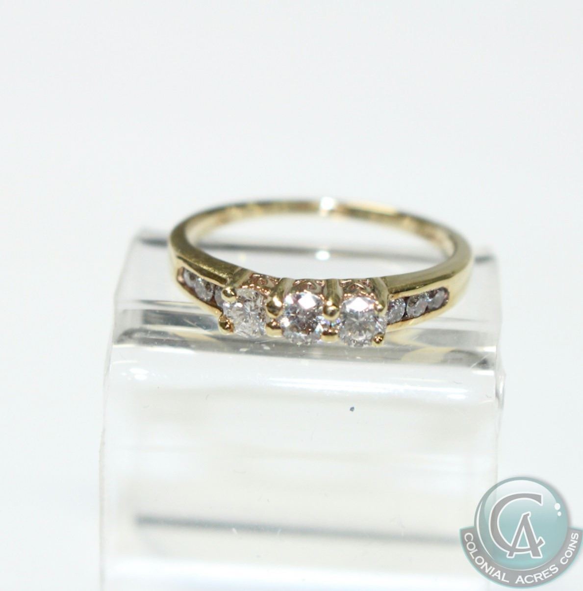 Lady's 14K Yellow Gold Trinity Diamond Ring Size 8. Ring Contains at