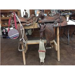 Two Used Saddles and One Canteen