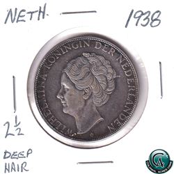 Netherlands 1938 Silver 2 1/2 Gulden deep hair variety. Coin is .720 pure and weighs 25 grams.