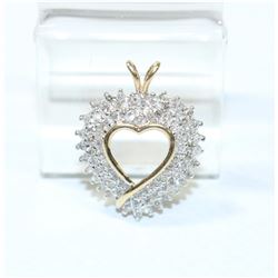 Lady's 10K Yellow/White Gold Diamond Heart Pendant.  This Beautiful pendant has been handcrafted wit