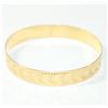 Image 1 : Lady's 10K Yellow Gold Etched Bangle Bracelet. Measures approx. 2 3/4 inches in diameter and weighs 