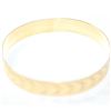 Image 2 : Lady's 10K Yellow Gold Etched Bangle Bracelet. Measures approx. 2 3/4 inches in diameter and weighs 