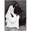 Image 1 : COUPLE ASSIS, ELLE ROBE NOIRE, LUI DJELLABA BLANCHE, FOND NOIR, 1952-1955