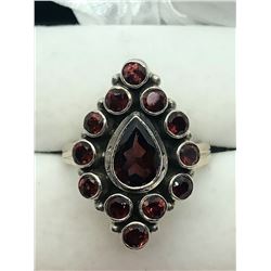 76) STERLING SILVER GARNET RING