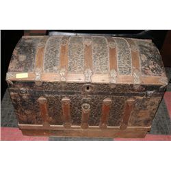 ANTIQUE HUMPBACK TRUNK WITH EMBOSSED GILT &