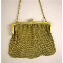 A YELLOW GOLD MESH BAG