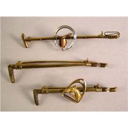 A YELLOW AND WHITE GOLD BAR PIN