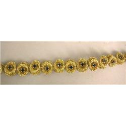 AN 18K YELLOW GOLD AND SAPPHIRE FLORA-FORM LINK BRACELET