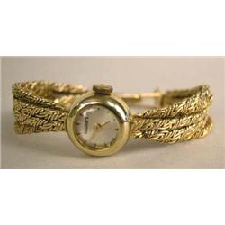 A 14K YELLOW GOLD LADIES WATCH WITH FIVE STRAND BRAIDED 14K YELLOW GOLD BAND