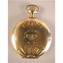 A LADIES GOLD POCKET WATCH WITH ENGRAVED DESIGN