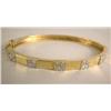 Image 1 : A YELLOW GOLD AND DIAMOND BANGLE BRACELET