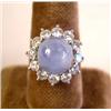 Image 1 : A WHITE GOLD WITH CENTER STAR SAPPHIRE SURROUNDED WITH DIAMONDS RING