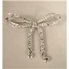 Image 1 : A TIFFANY & CO. PLATINUM AND DIAMOND RIBBON AND BOW BROOCH