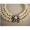 Image 1 : A THREE STRAND PEARL NECKLACE WITH PLATINUM OVER GOLD PEARL AND DIAMOND FLORA-FORM CLASP