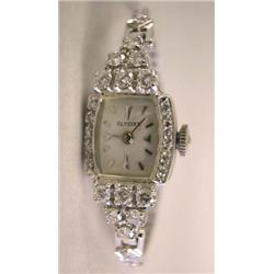 A 14K WHITE GOLD AND DIAMOND WATCH