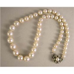 A STRAND OF GRADUATED PEARLS WITH DIAMOND CLASP