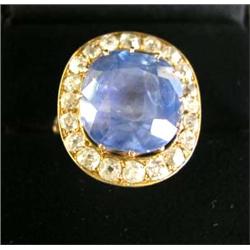 A 14K YELLOW GOLD DIAMOND AND TANZANITE RING