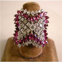 A 14K WHITE GOLD DIAMOND AND RUBY RING