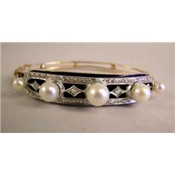 A 14K YELLOW GOLD DIAMOND AND PEARL ON COBALT ENAMEL PLAQUE BANGLE BRACELET