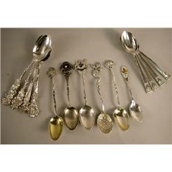 A GROUP OF STERLING SILVER DEMITASSE SPOONS