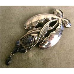 A GEORG JENSEN STERLING SILVER AND MOONSTONE BROOCH