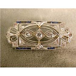 A PLATINUM DIAMOND, SAPPHIRE FILIGREE BROOCH