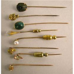 A GROUP OF EIGHT STICK PINS