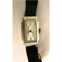 A WALTHAM WRISTWATCH ON BLACK RIBBON