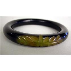 A CARVED BAKELITE BRACELET