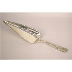 A TIFFANY & CO. "CHRYSANTHEMUM" PATTERN (PAT. 1880) STERLING SILVER CRUMBER