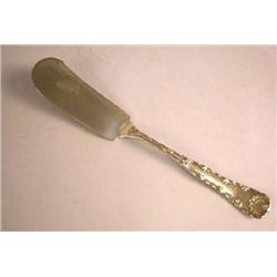 A TIFFANY & CO. "WAVE EDGE" PATTERN STERLING SILVER MASTER BUTTER KNIFE