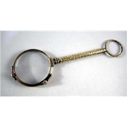 A YELLOW GOLD FILLED LORGNETTE RETAILED BY C.W. DIXEY