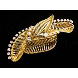 A MARIANNE OSTIER 18K YELLOW GOLD AND DIAMOND LEAF FORM BROOCH