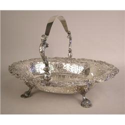 AN ENGLISH STERLING SILVER HANDLED OVAL CAKE BASKET