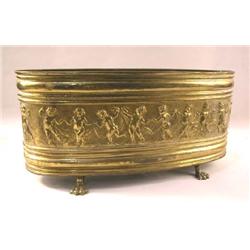 A VICTORIAN REPOUSSE BRASS JARDINIERE
