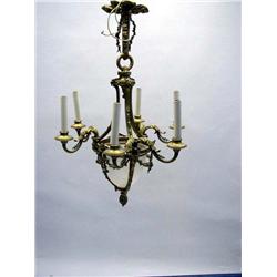 A LOUIS XVI STYLE BRASS SIX-LIGHT CHANDELIER