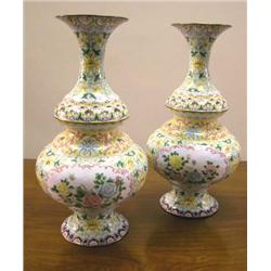 A PAIR OF POLYCHROME-DECORATED URNS