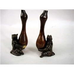 A BRONZE FIGURE OF A SEATED RABBIT HOLDING AN INCENSE URN