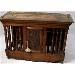 A FRENCH PROVINCIAL CARVED AND TURNED WALNUT PANETIERE