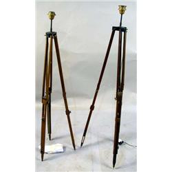TWO ADJUSTABLE SURVEYOR'S BEECHWOOD TRIPOD LAMPS