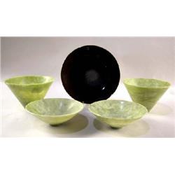A GROUP OF EIGHT GREEN SOAPSTONE SERVING BOWLS