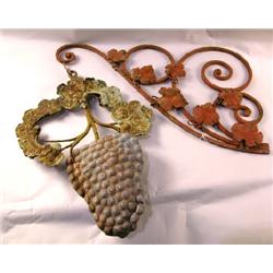 A RED PINK DECORATED IRON PLANT HANGER