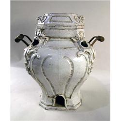 A WHITE GLAZED FAÏENCE STYLE DOUBLE HANDLED DIMINUTIVE STOVE