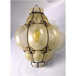 A COLORLESS GLASS AND STRAPWORK BORDERED HANGING HALL LANTERN