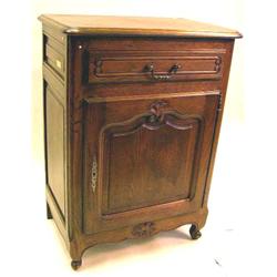 A LOUIS XV STYLE CARVED OAK SIDE CABINET