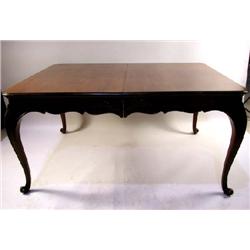 A LOUIS XV STYLE CARVED CHERRYWOOD DINING TABLE